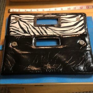 Gap black shiny clutch with zebra print inside